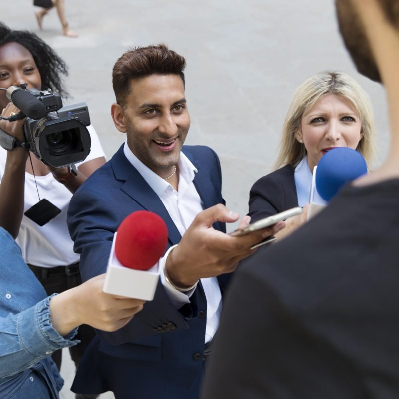 close-up-interviewee-with-microphone-taking-statements